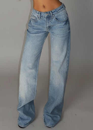 Jeans modello wide leg decorati con strass.